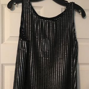 Metallic Silver and Black sleeveless shirt.